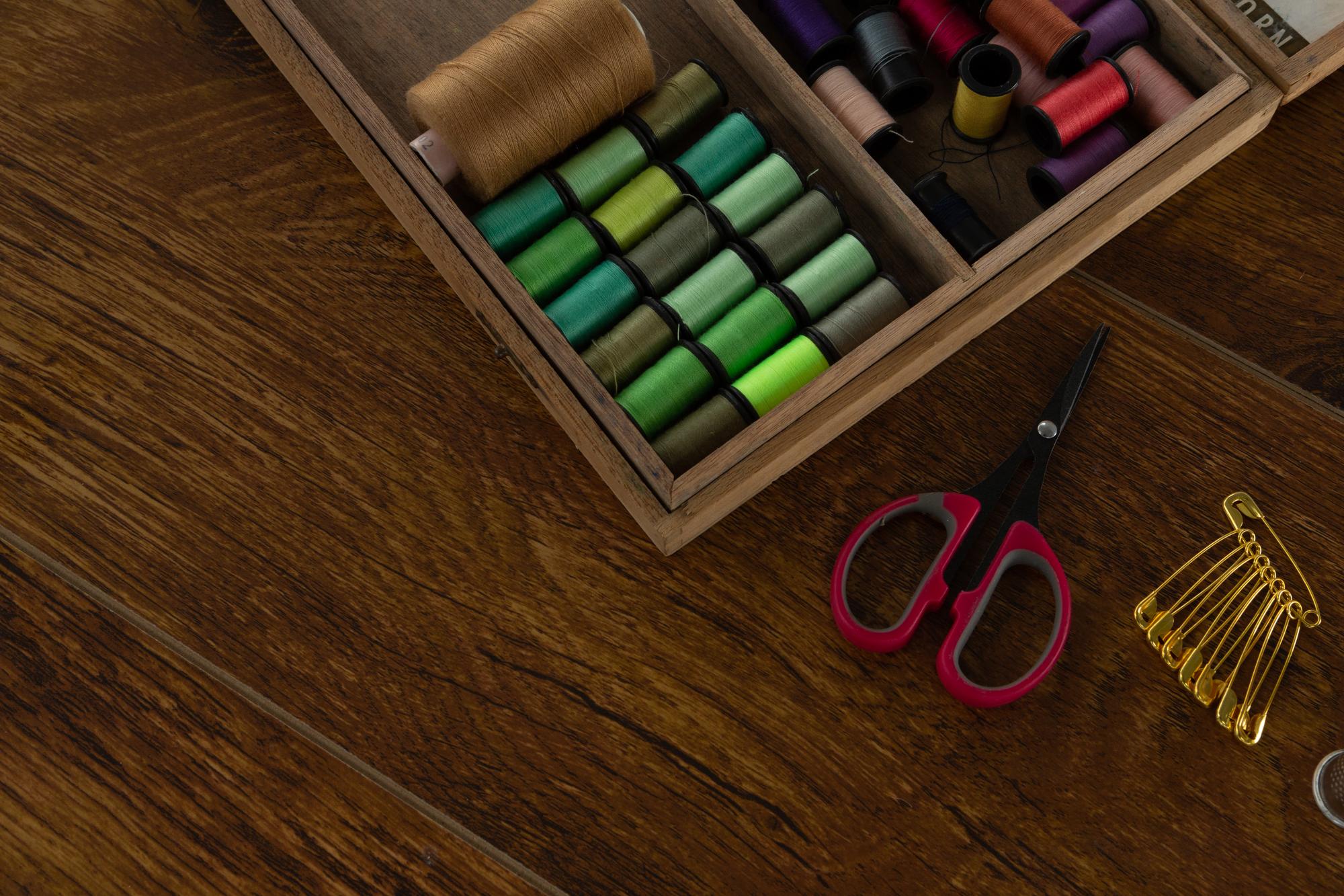 Workspace with embroidery sample and tools